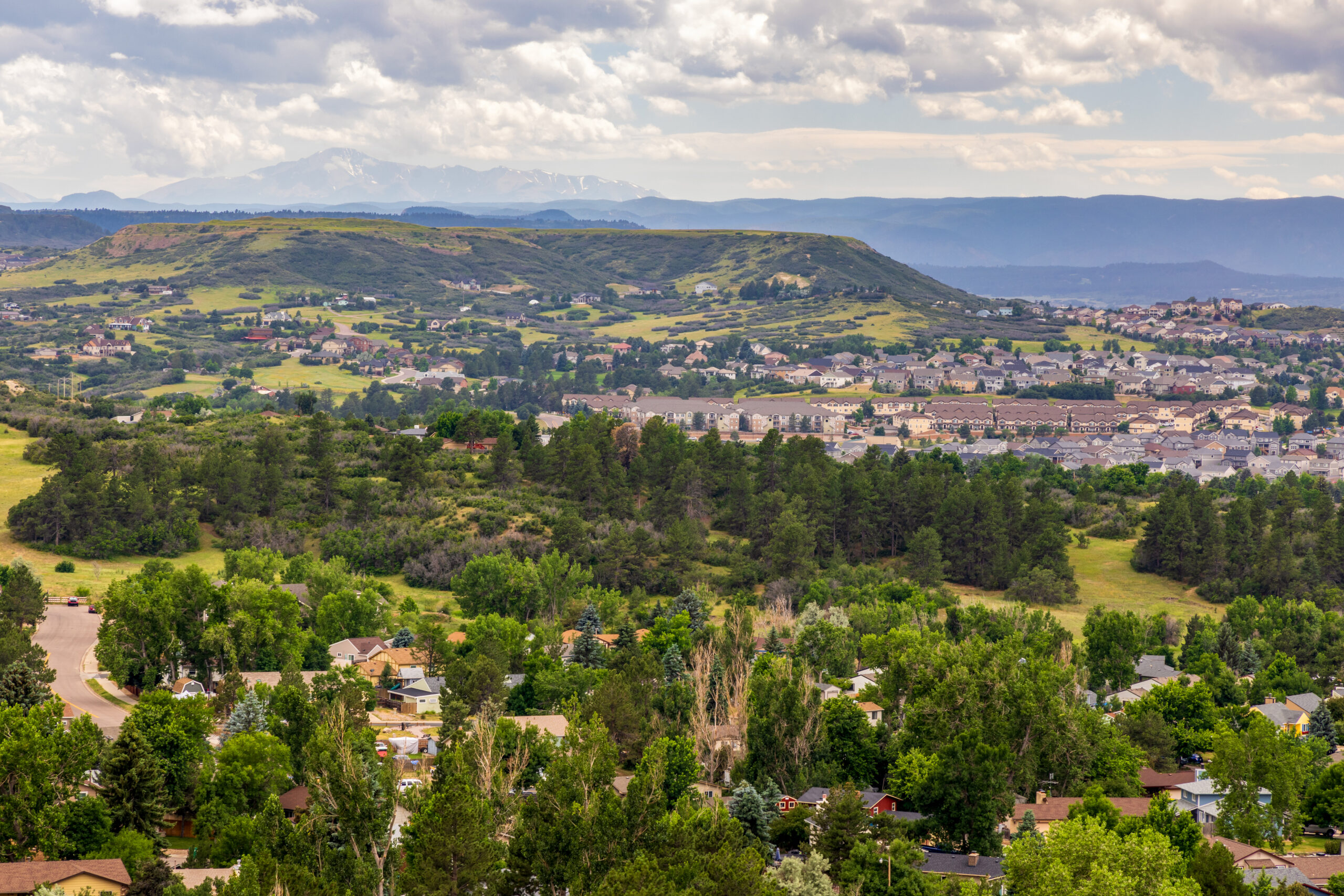 Scenic neighborhood view of Castle Pines, Colorado, showcasing residential homes and natural surroundings