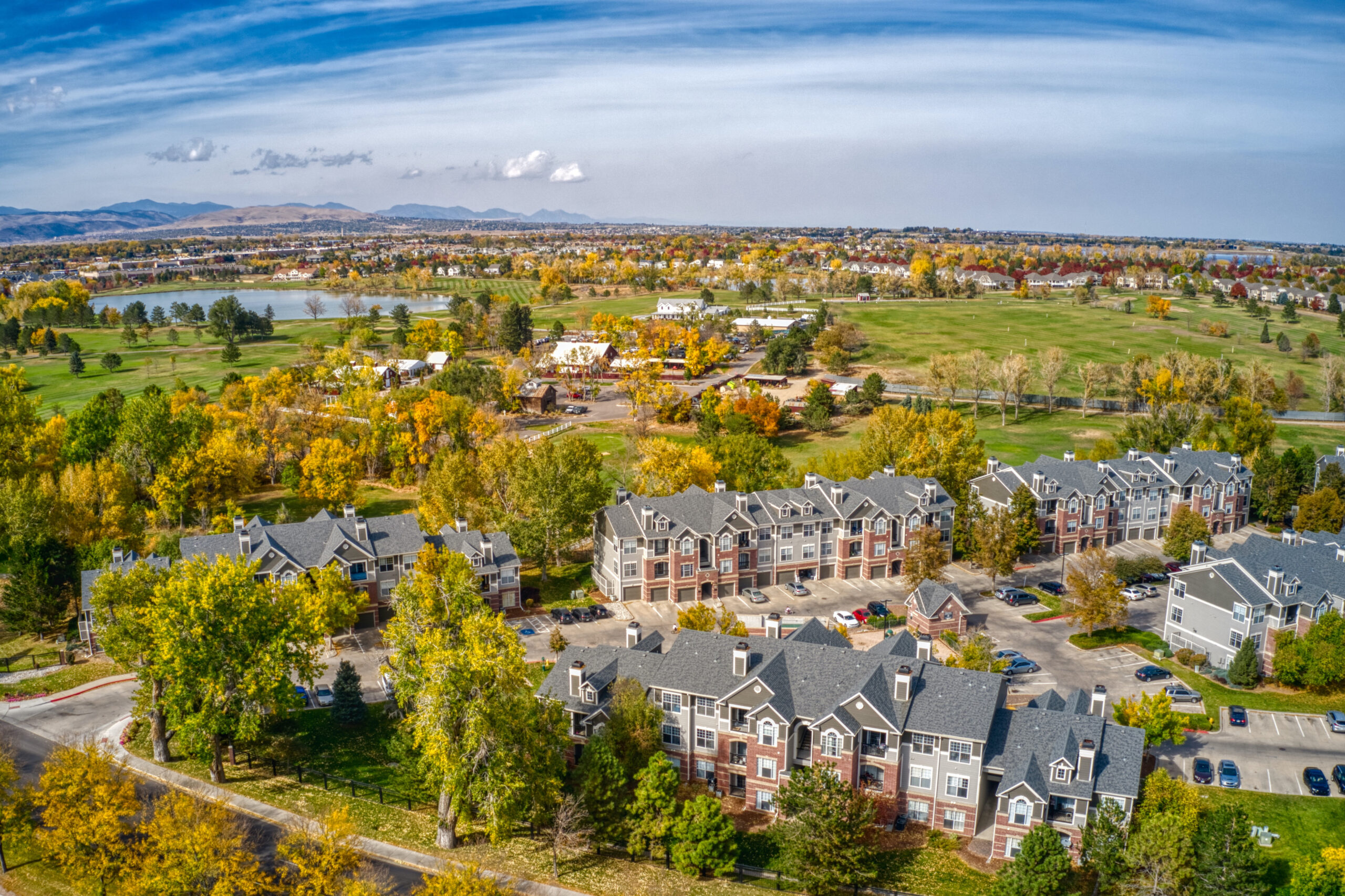 Scenic view of Englewood, Colorado skyline with residential homes and mountains in the background