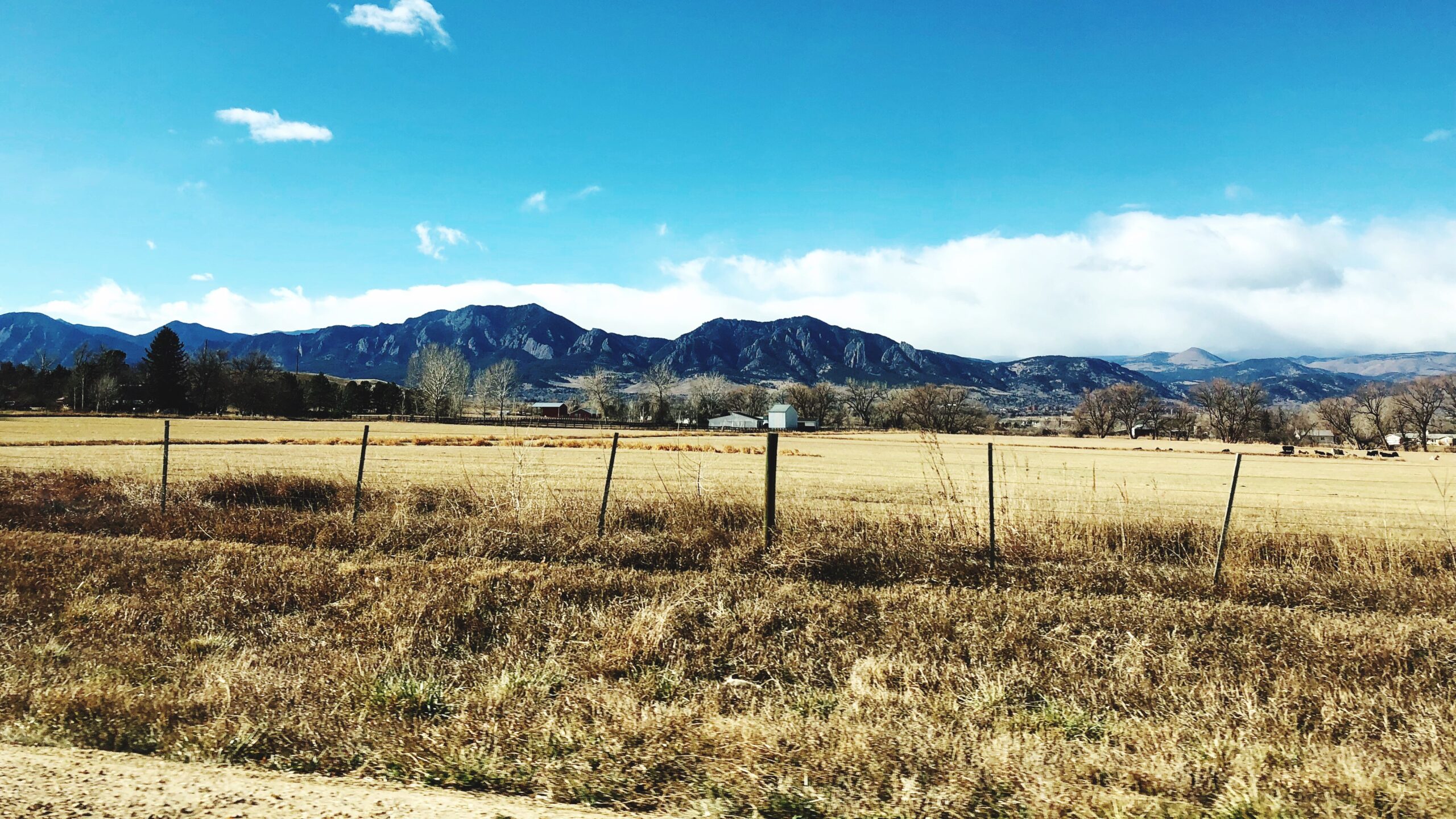 Scenic view of downtown Louisville, Colorado with mountains in the background