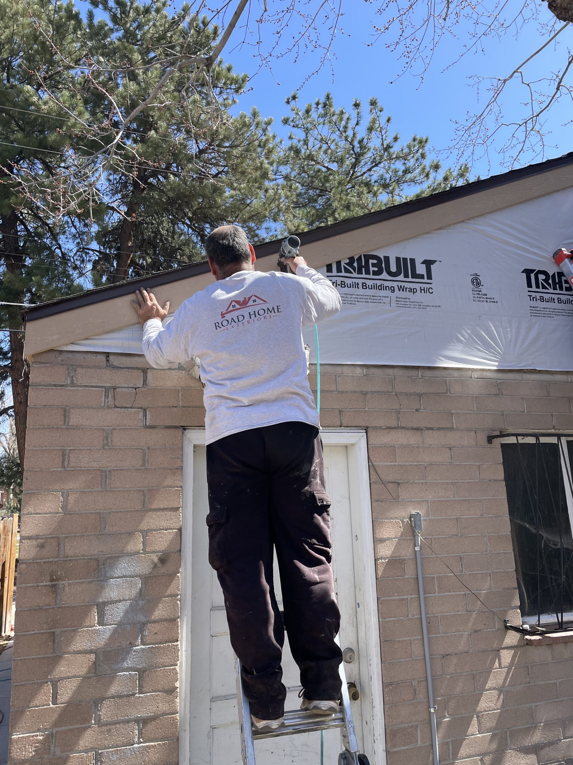 Crew installing new siding on a home in Centennial, Colorado