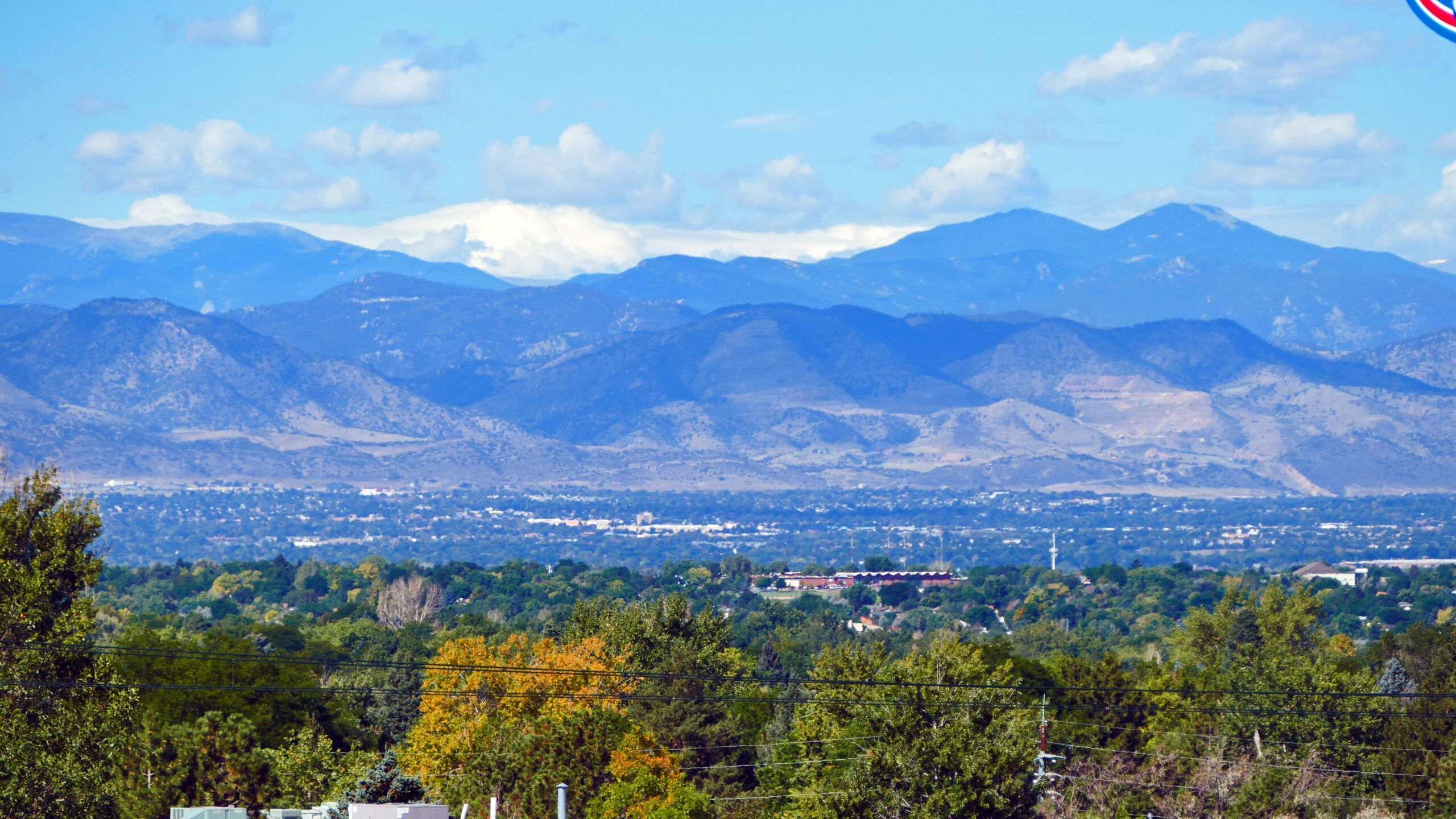 Scenic view of Wheat Ridge, Colorado with residential homes and mountain backdrop